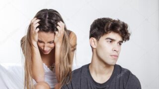 Upset couple mad at each other in their living room