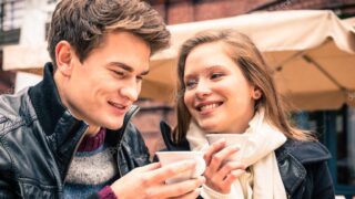 Young Couple lovely enjoying a cup of Coffee